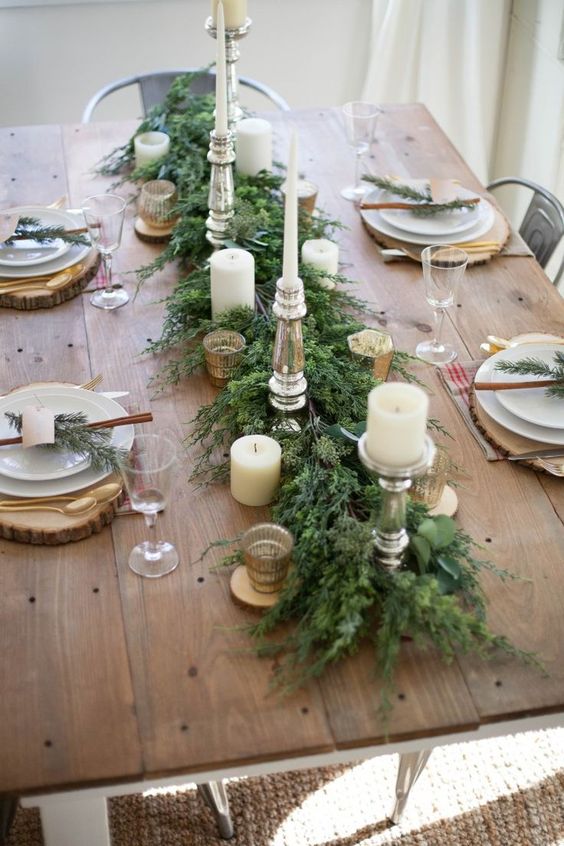 farmhouse style table centerpiece with a wooden tray, natural elements, candles, and farmhouse ornaments