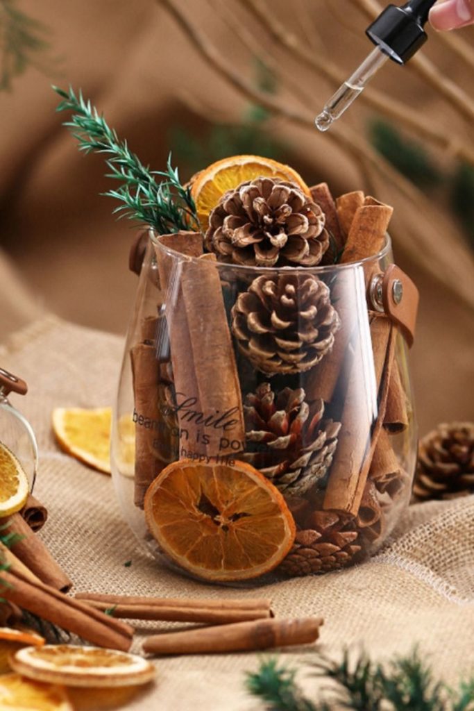 A rustic wooden bowl filled with various sizes of pinecones placed on a kitchen countertop