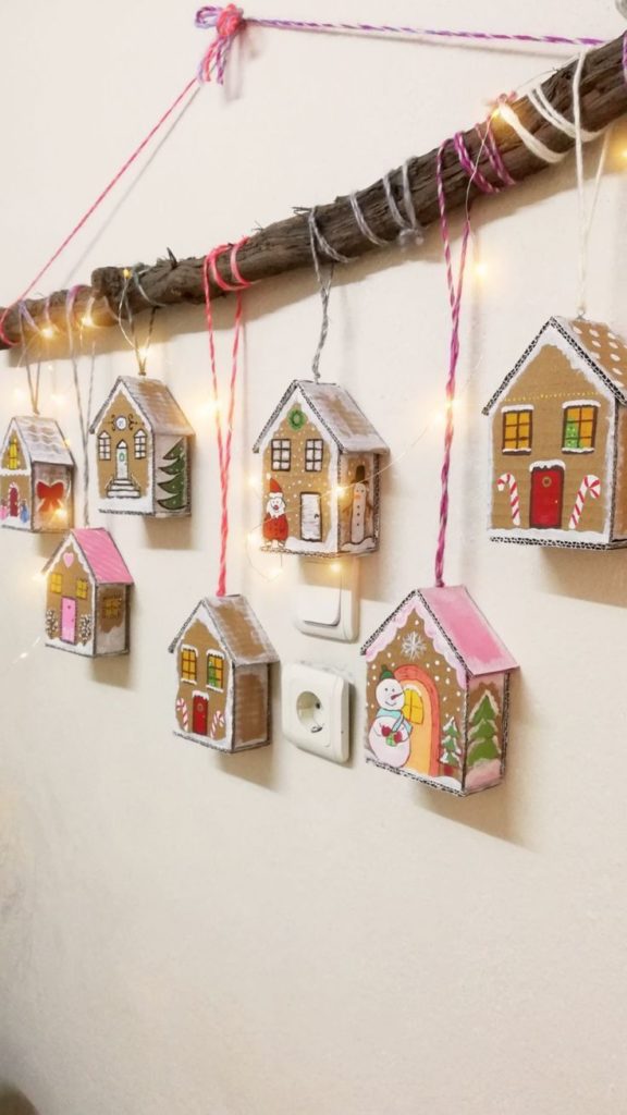 An assortment of gingerbread ornaments, including gingerbread men, snowflakes, and stars, decorated with frosting, sprinkles, and edible embellishments.