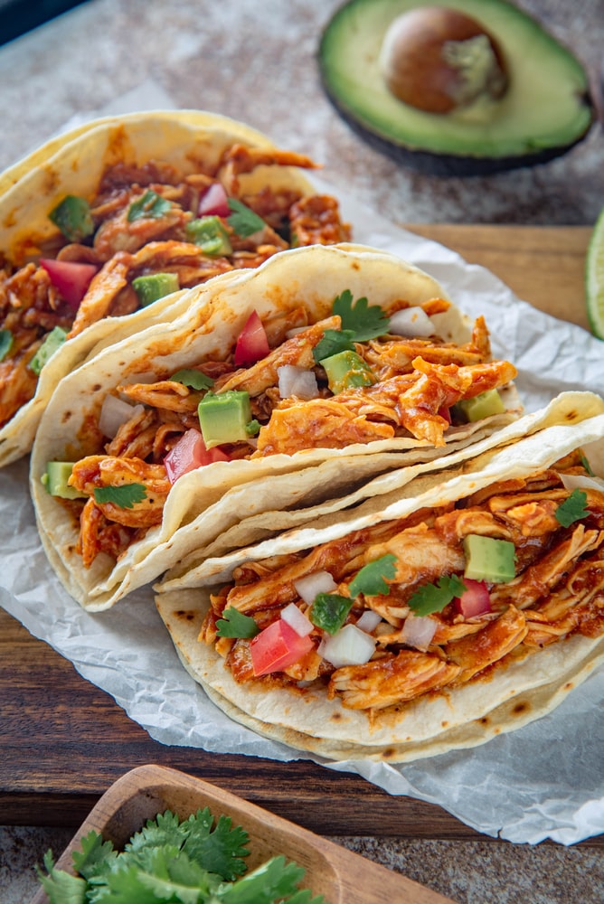easy slow cooker queso chicken tacos